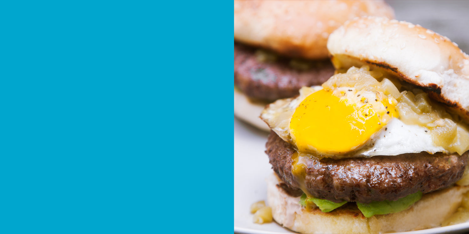 A burger with a fried egg sticking out