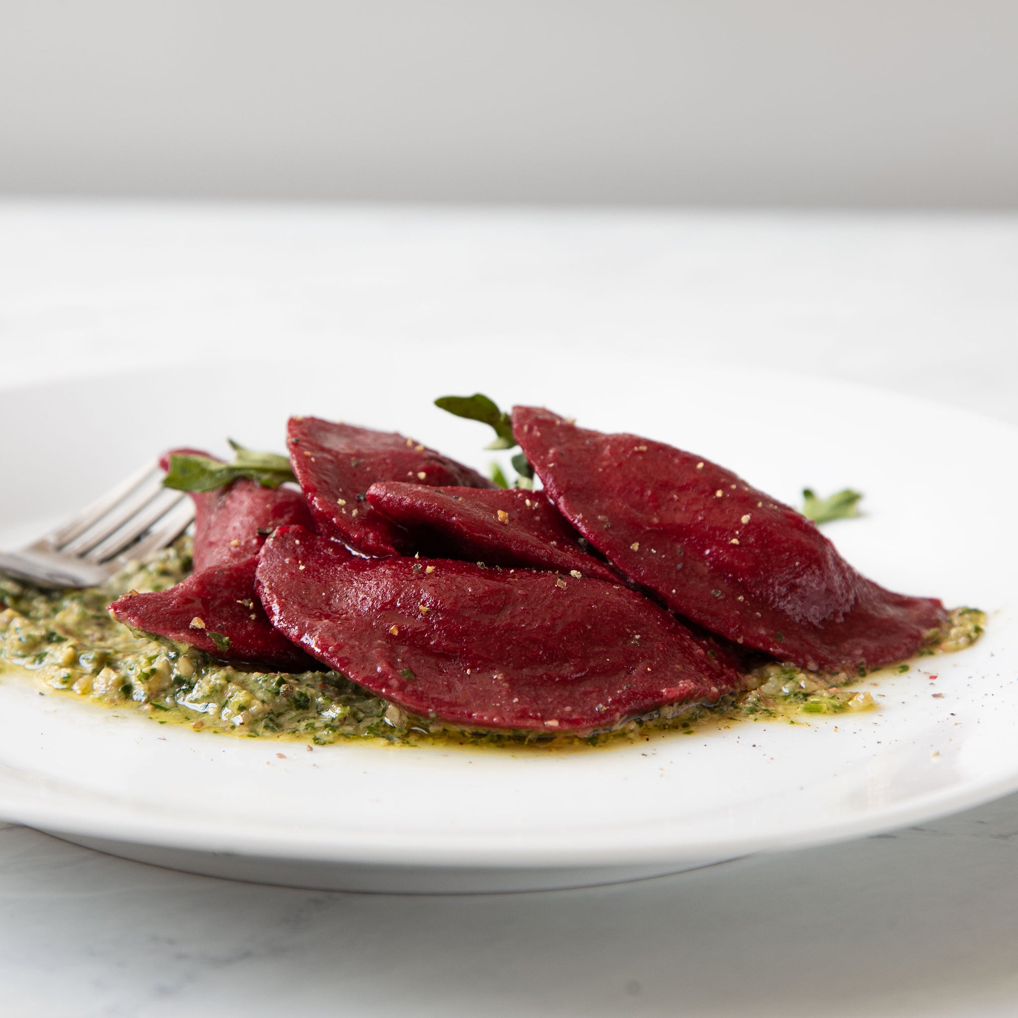 Beet Ravioli with Chuck Roast and Walnut Arugula Pesto