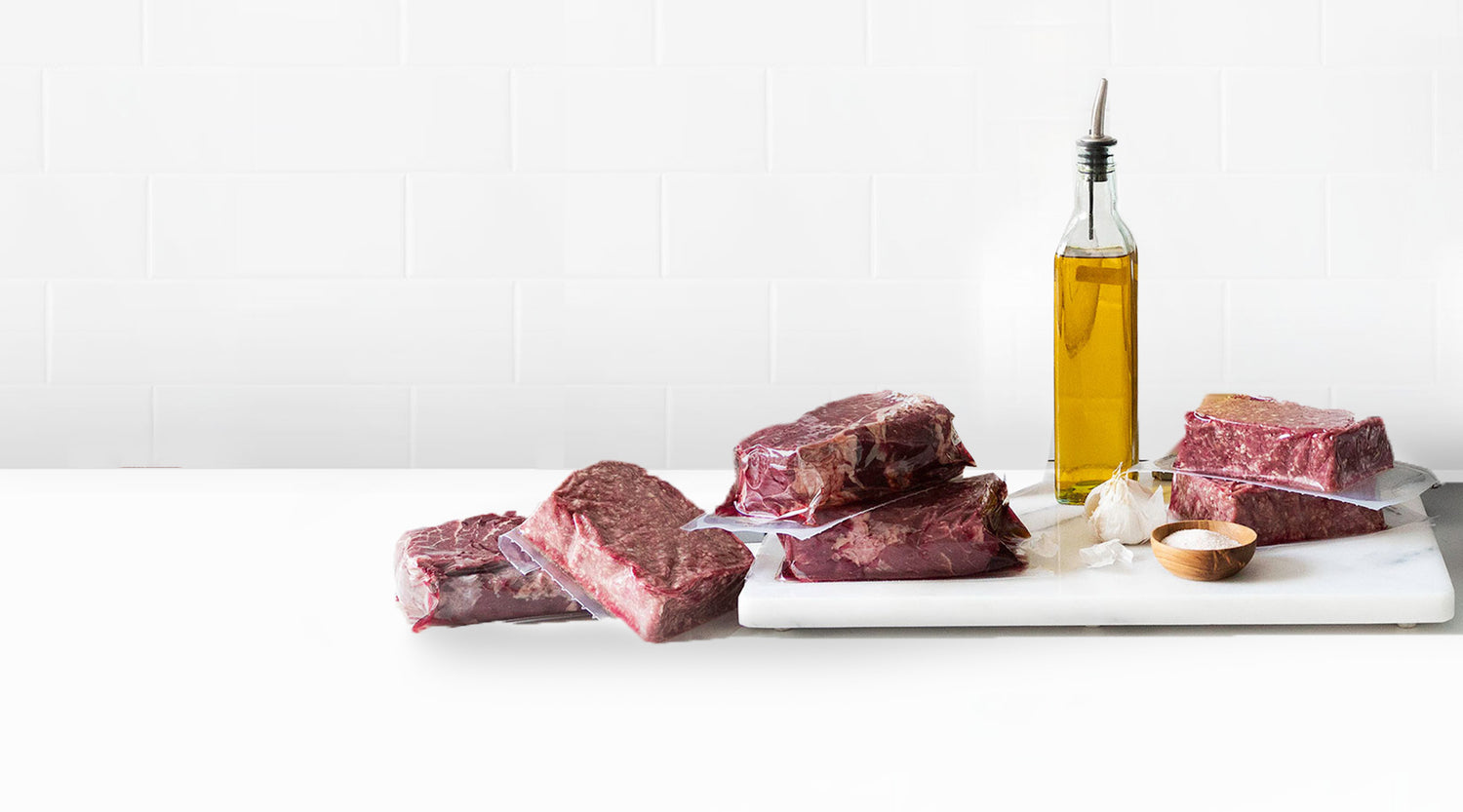 Packaged Steaks with Olive Oil Bottle